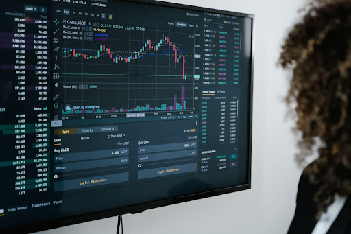 woman in front of computer screen monitor